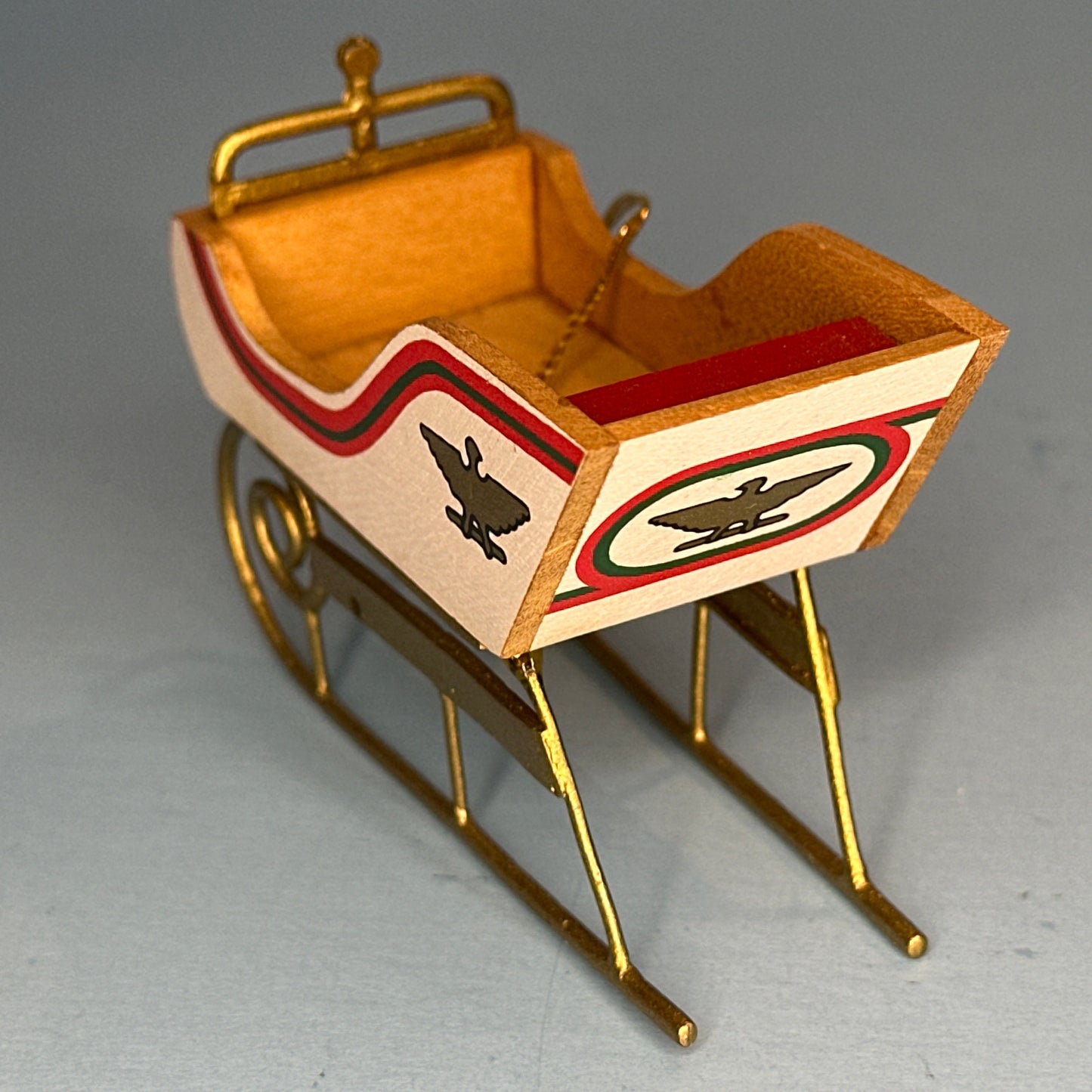 Miniature Decorative Sled with Golden Accents and Eagle Motifs – 1:12 Scale