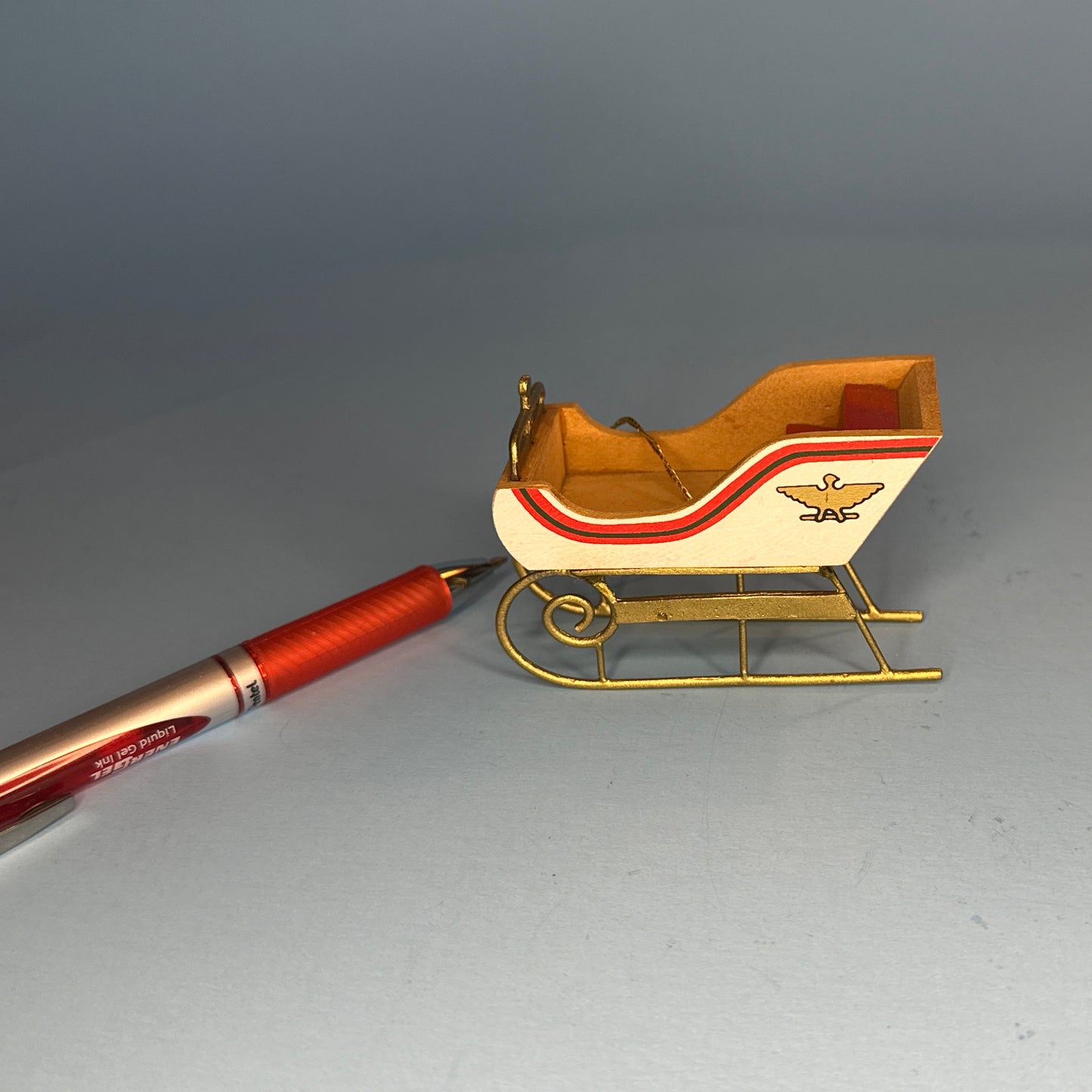 Miniature Decorative Sled with Golden Accents and Eagle Motifs – 1:12 Scale
