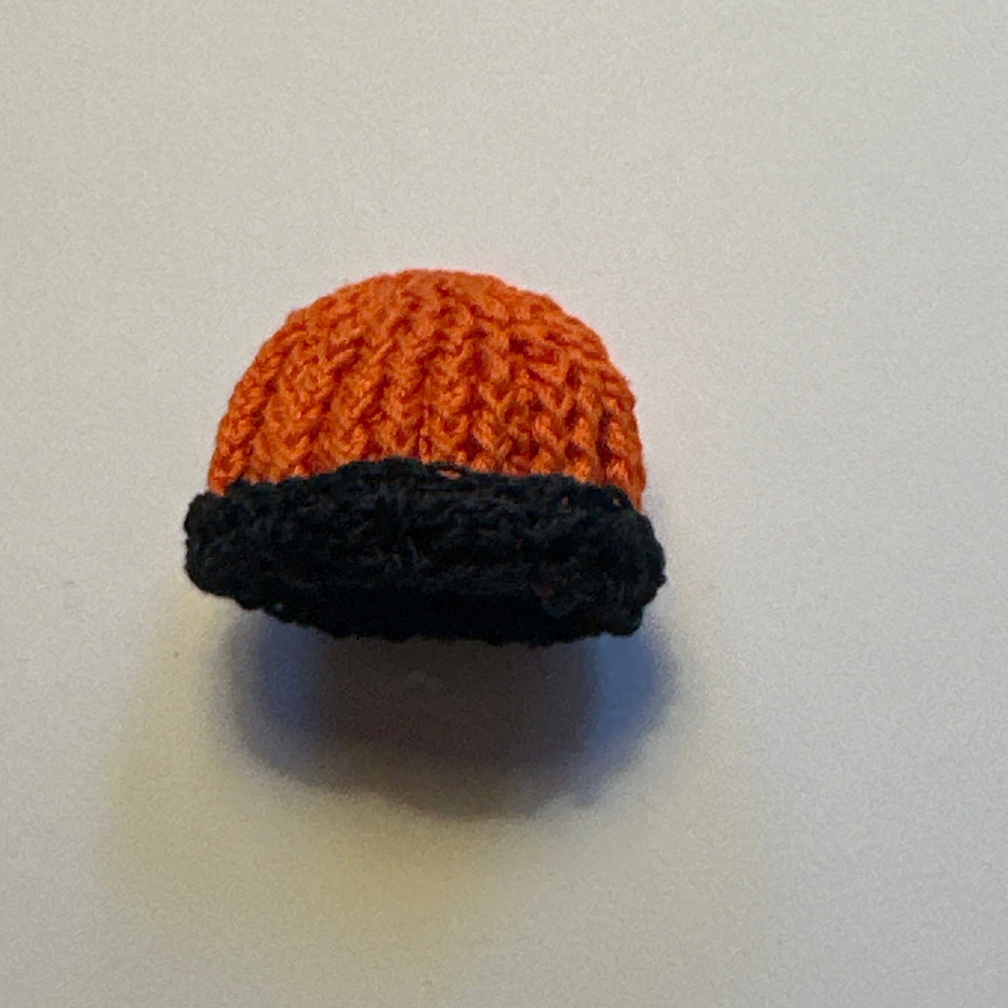 Dollhouse Miniature – Orange Knitted Hat with Black Trim 1:12