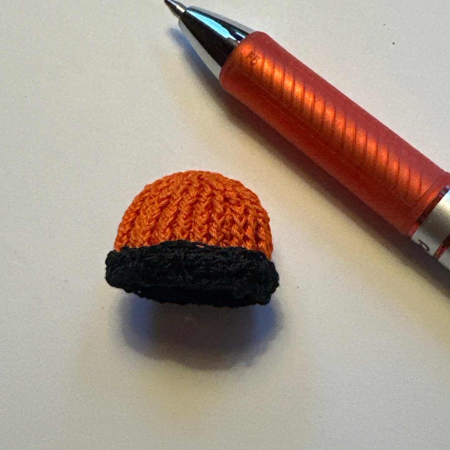 Dollhouse Miniature – Orange Knitted Hat with Black Trim 1:12