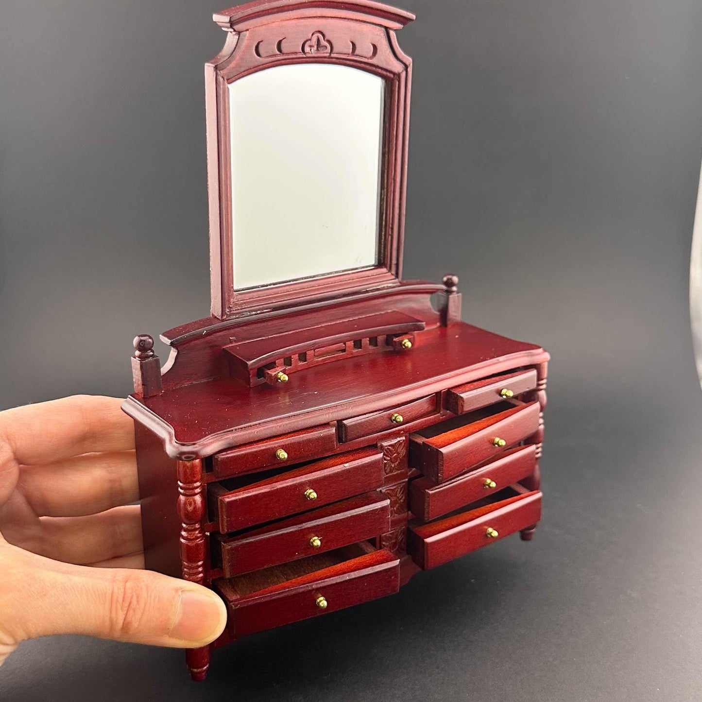 Miniature dresser with mirror for 1:12 scale dollhouse wood In mahogany color with functional drawers.