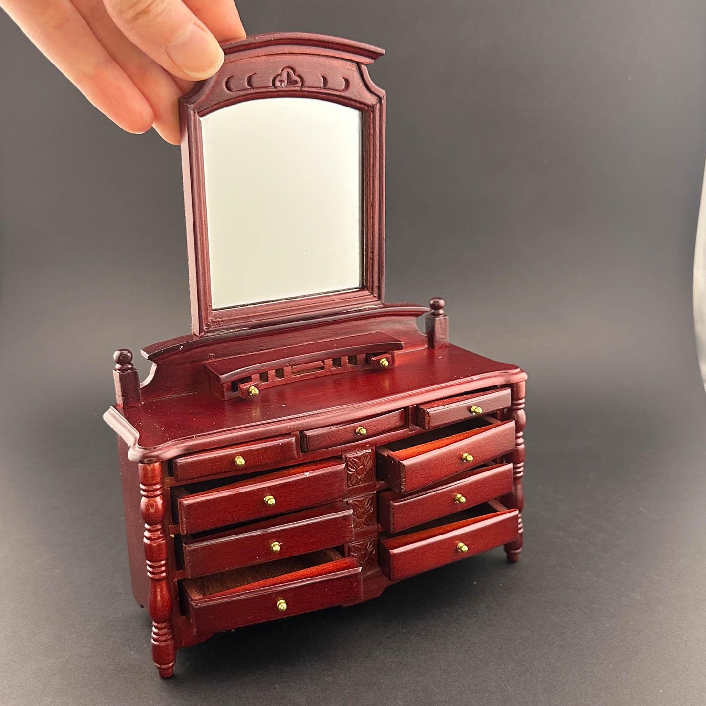 Miniature dresser with mirror for 1:12 scale dollhouse wood In mahogany color with functional drawers.