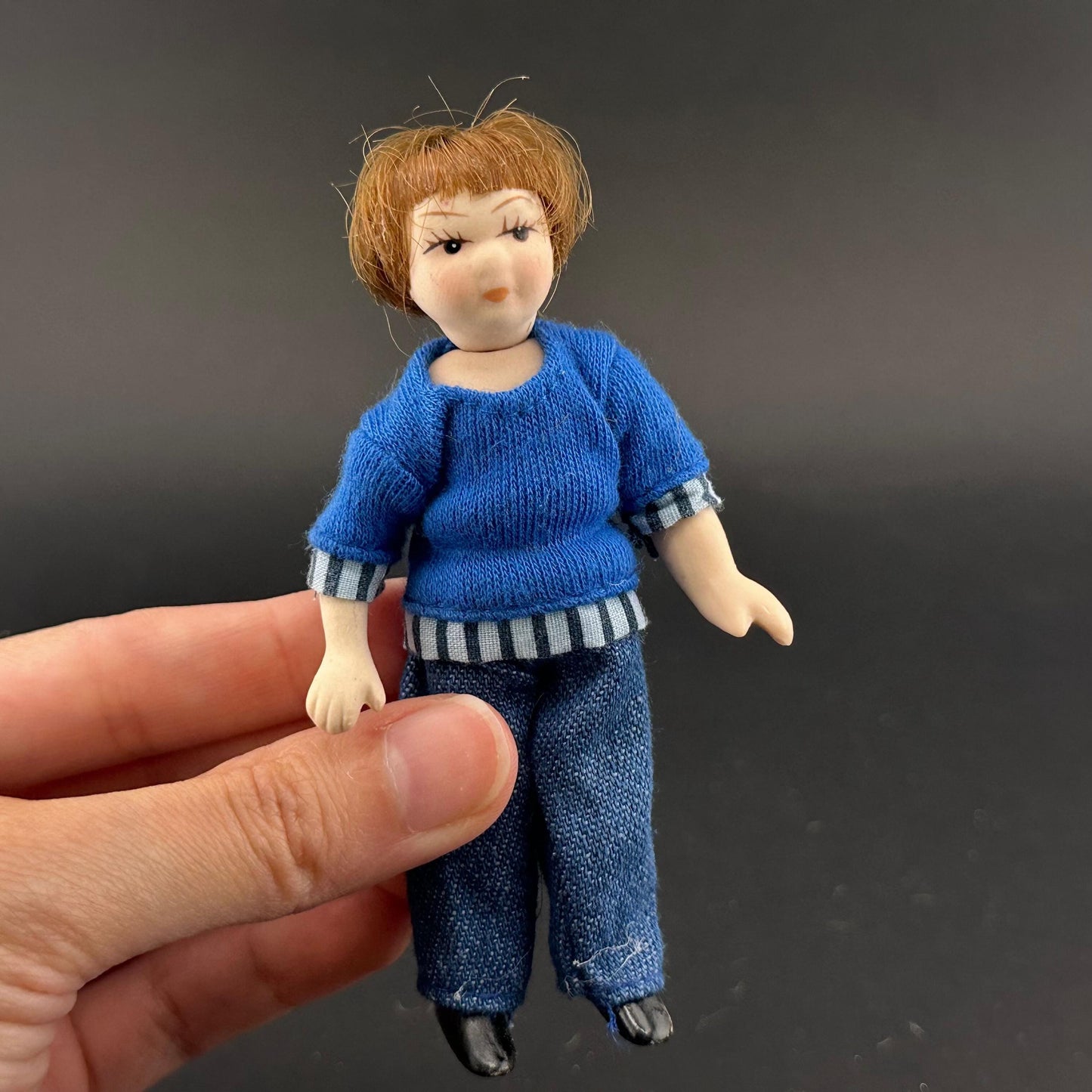 1:12 Scale Porcelain girl Doll – Dollhouse Miniature Child – Movable Head and Limbs – Blue Sweater & Jeans – 4” (10 cm)