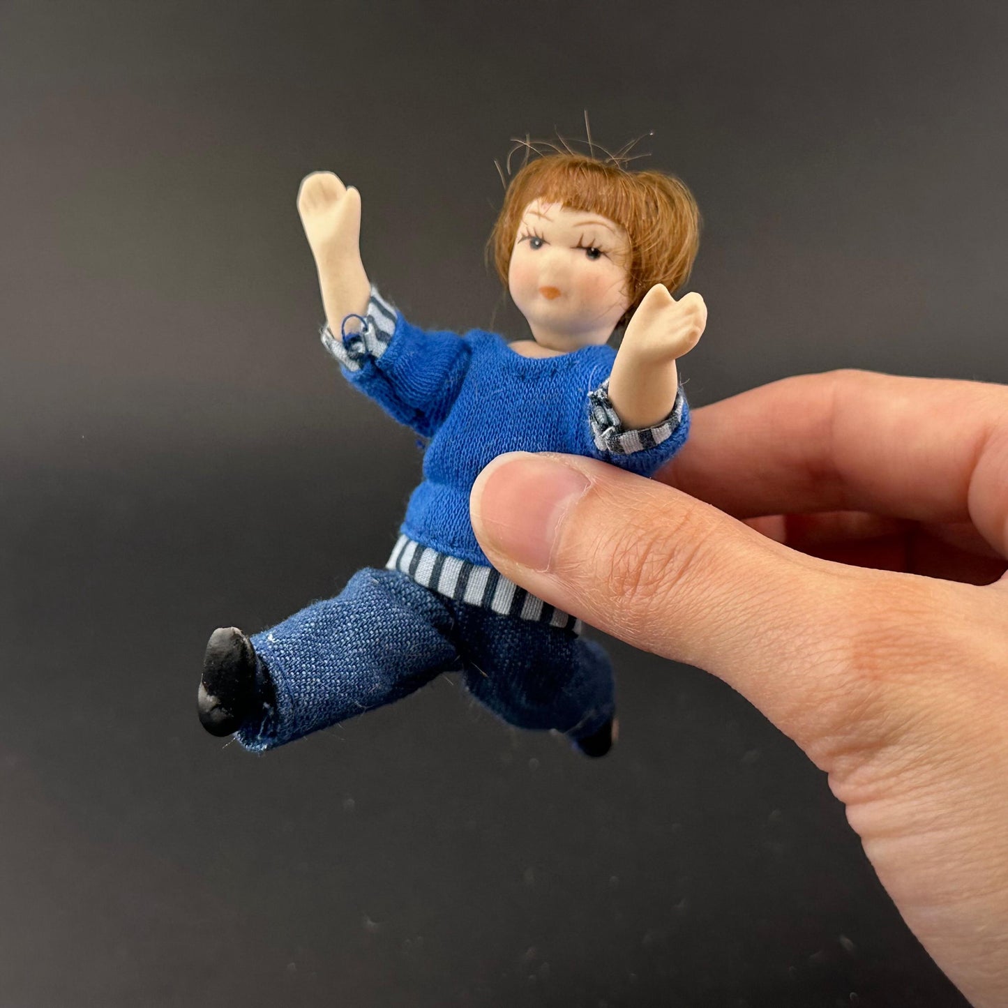 1:12 Scale Porcelain girl Doll – Dollhouse Miniature Child – Movable Head and Limbs – Blue Sweater & Jeans – 4” (10 cm)