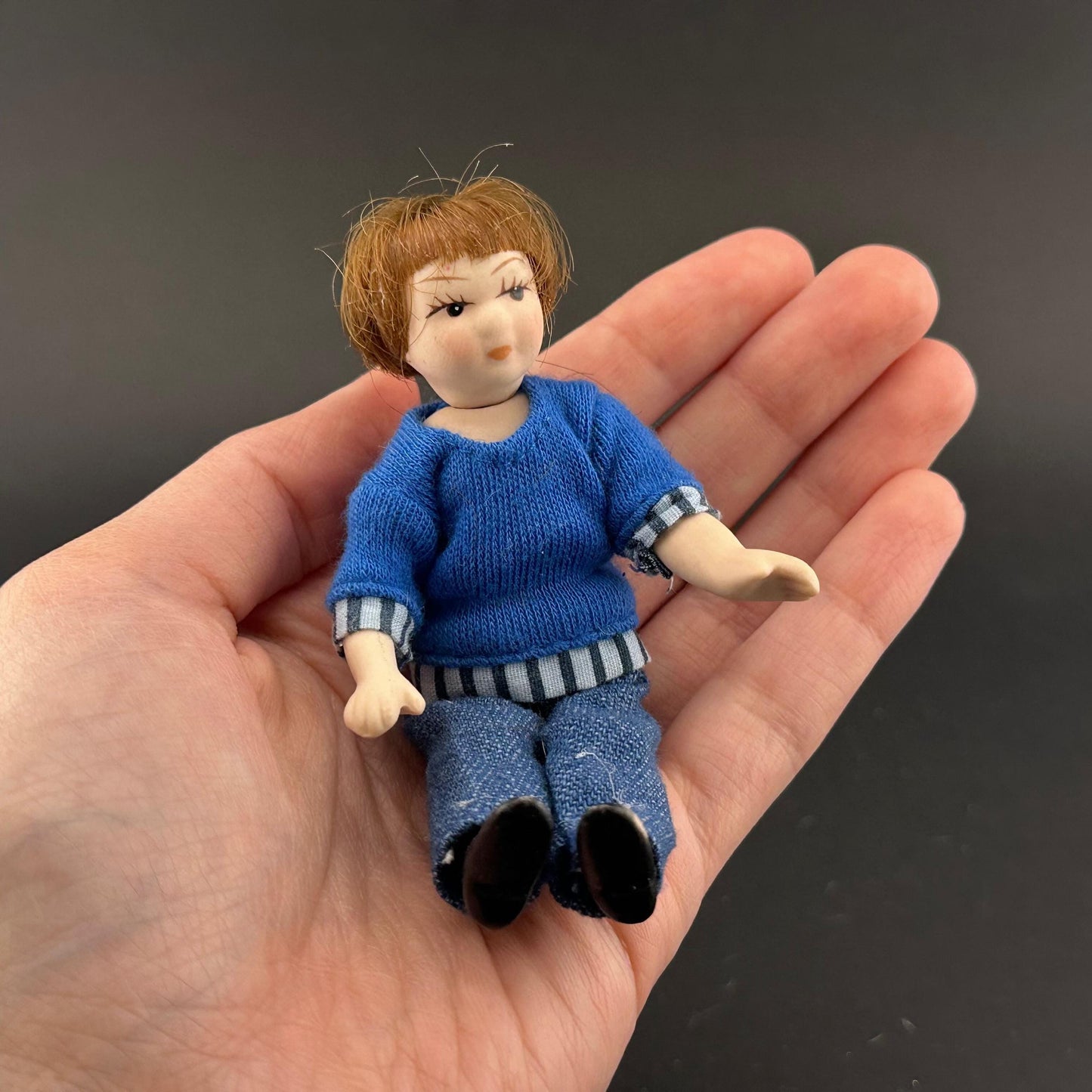 1:12 Scale Porcelain girl Doll – Dollhouse Miniature Child – Movable Head and Limbs – Blue Sweater & Jeans – 4” (10 cm)