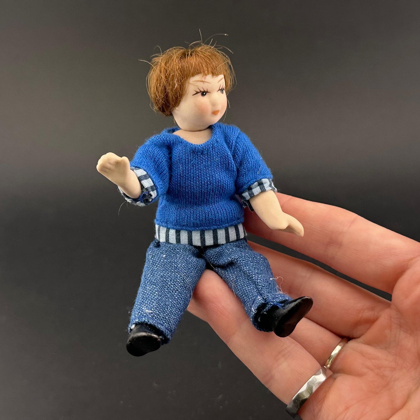 1:12 Scale Porcelain girl Doll – Dollhouse Miniature Child – Movable Head and Limbs – Blue Sweater & Jeans – 4” (10 cm)