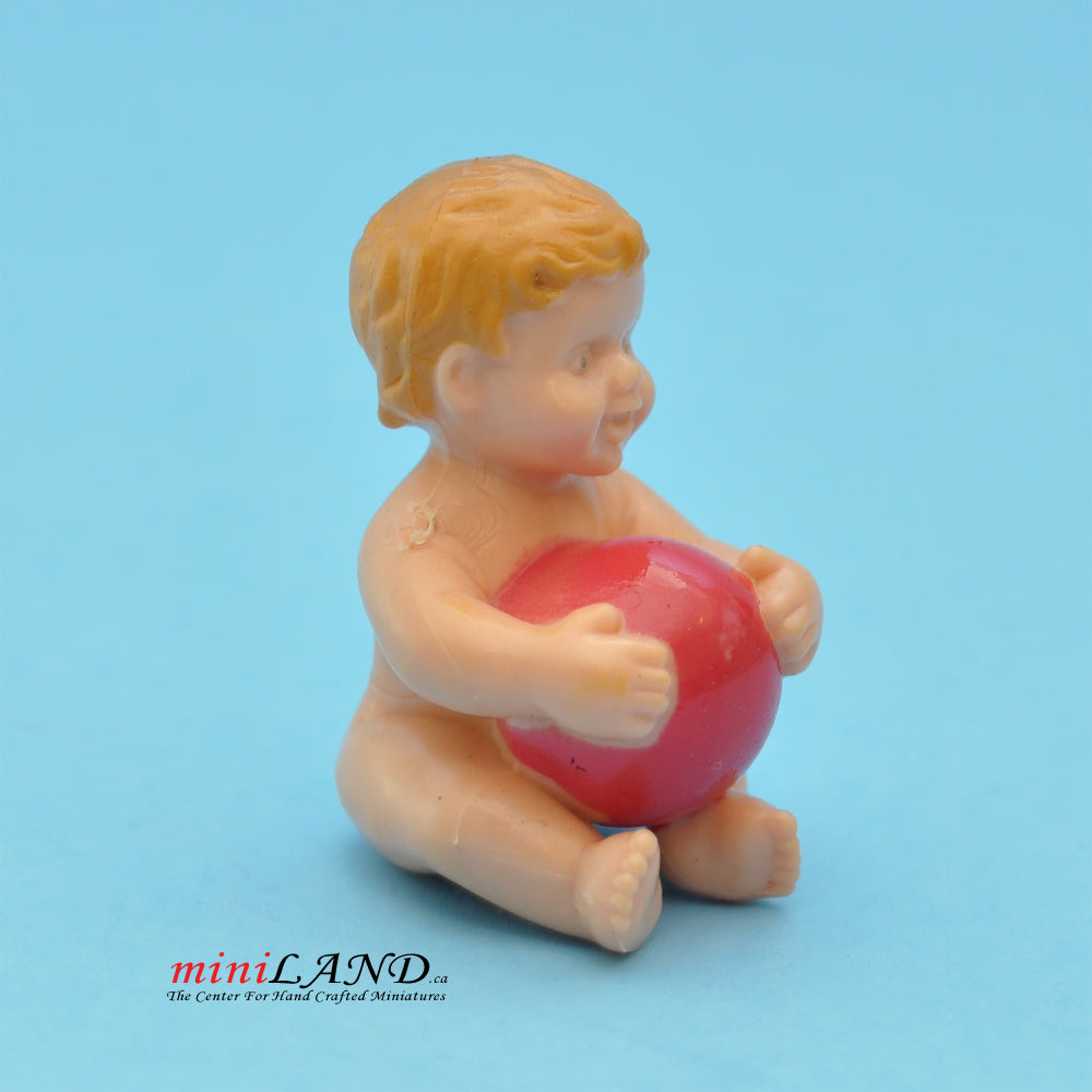 A baby sitting with a ball Doll for 1:12 dollhouse miniature