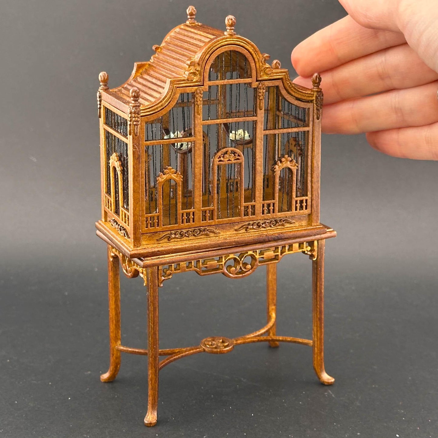 A magnificent wooden classic Victorian bird cage with a table for a 1:12 dollhouse miniature Walnut