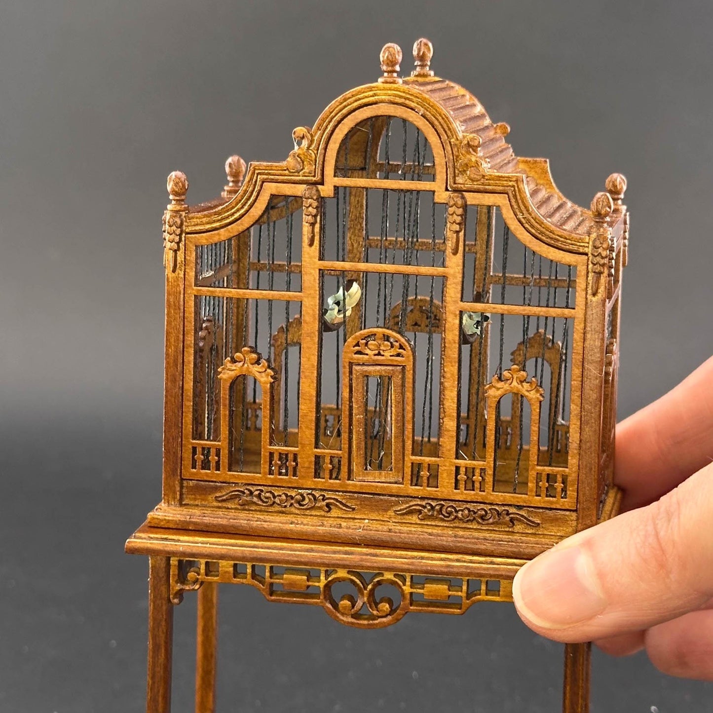 A magnificent wooden classic Victorian bird cage with a table for a 1:12 dollhouse miniature Walnut