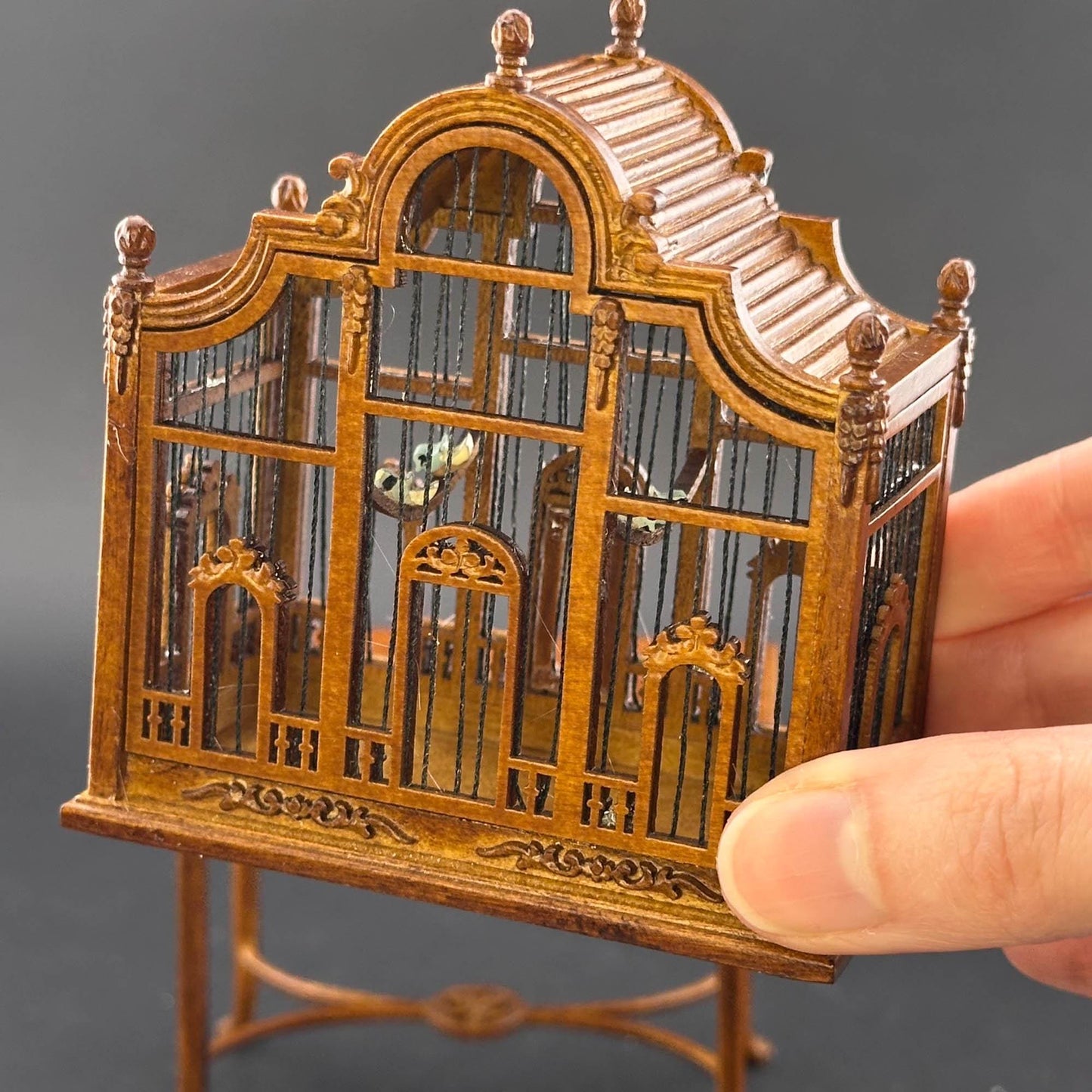 A magnificent wooden classic Victorian bird cage with a table for a 1:12 dollhouse miniature Walnut