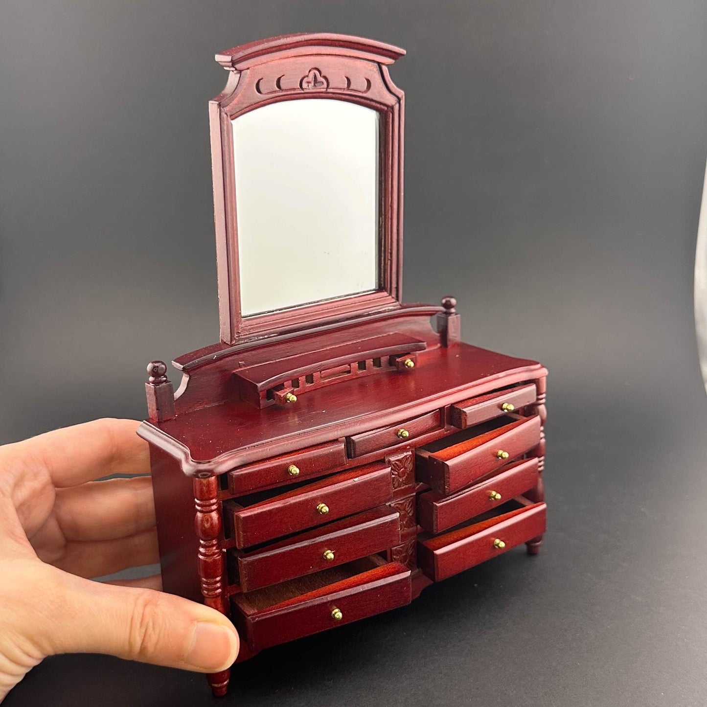 Miniature dresser with mirror for 1:12 scale dollhouse wood In mahogany color with functional drawers.