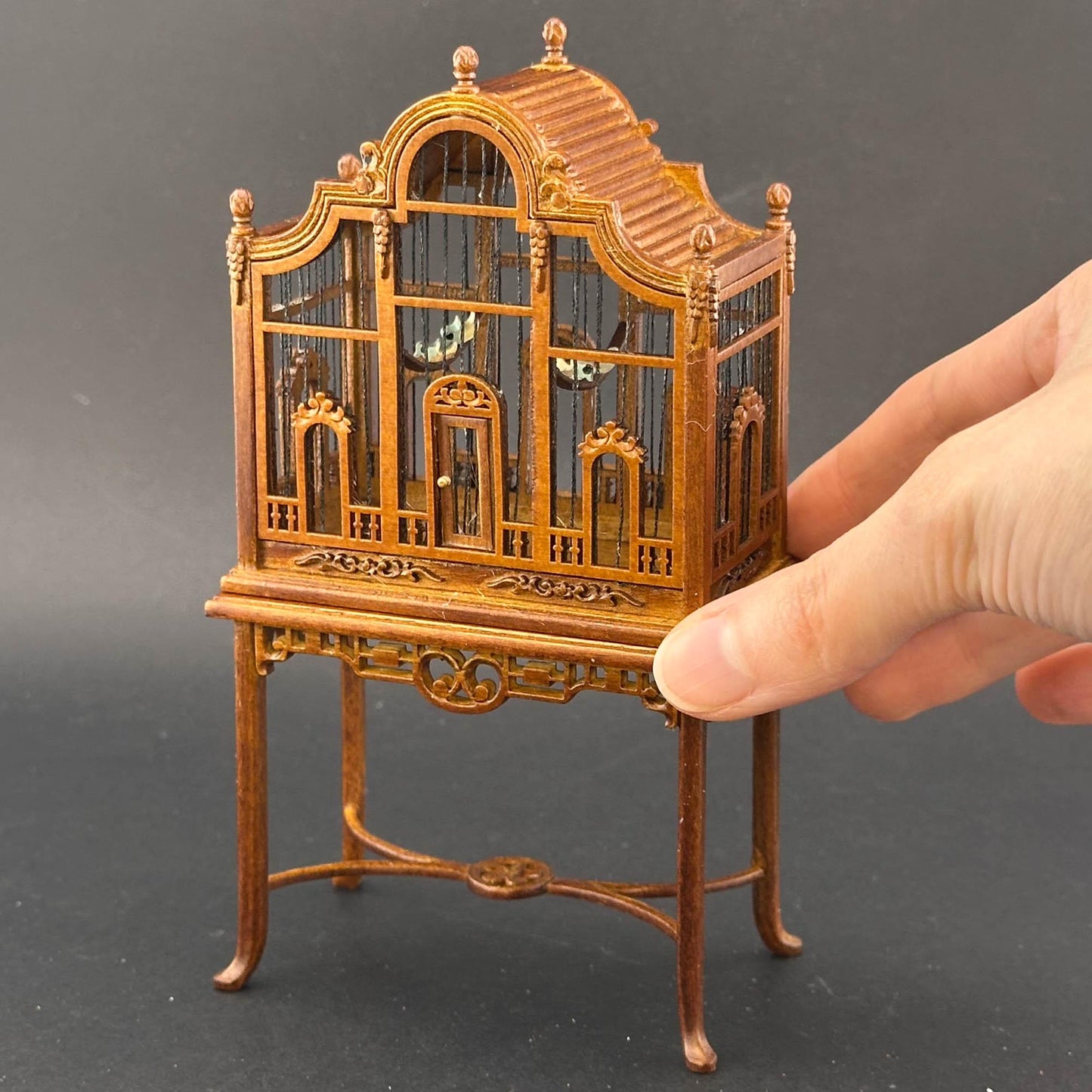 A magnificent wooden classic Victorian bird cage with a table for a 1:12 dollhouse miniature Walnut