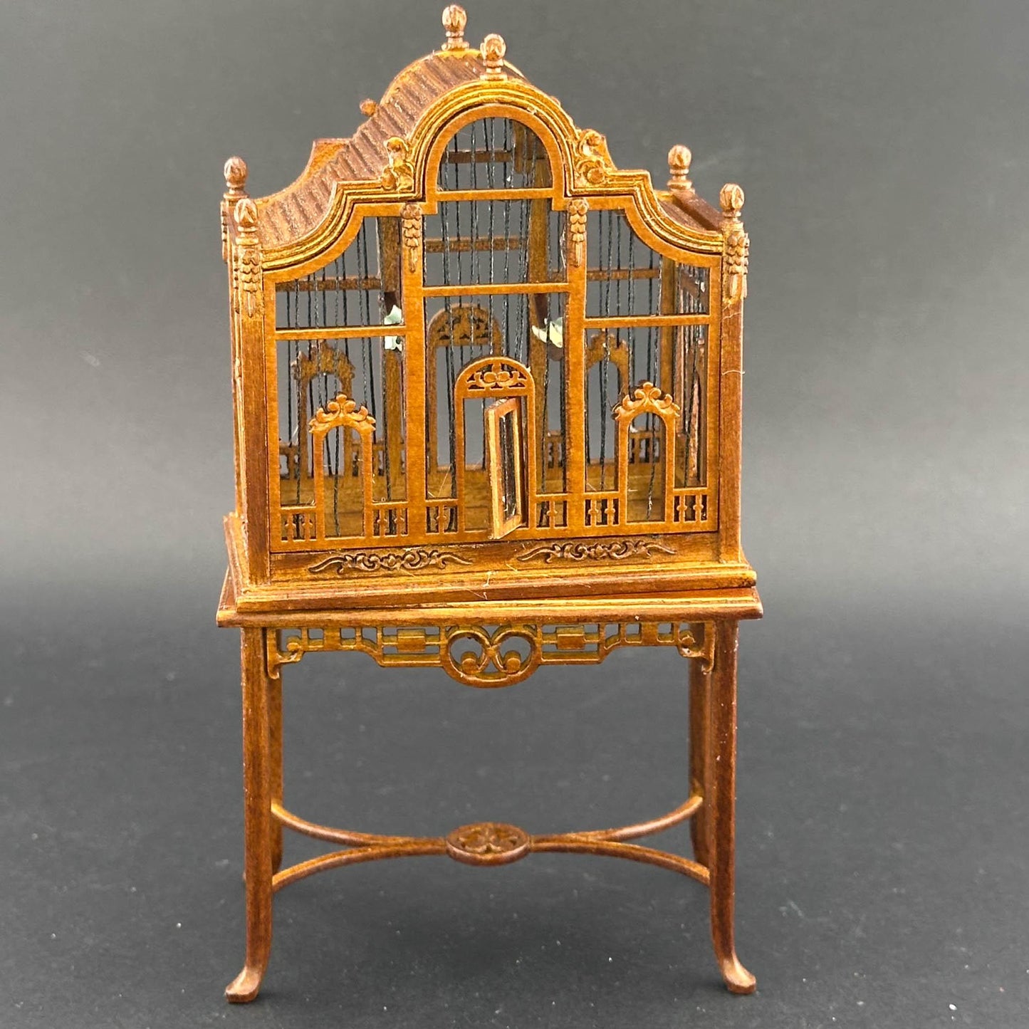 A magnificent wooden classic Victorian bird cage with a table for a 1:12 dollhouse miniature Walnut