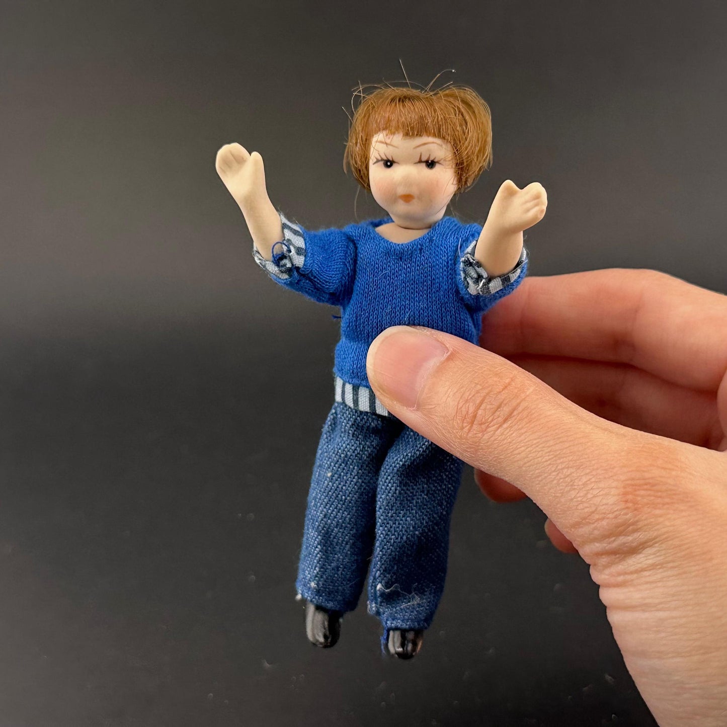1:12 Scale Porcelain girl Doll – Dollhouse Miniature Child – Movable Head and Limbs – Blue Sweater & Jeans – 4” (10 cm)