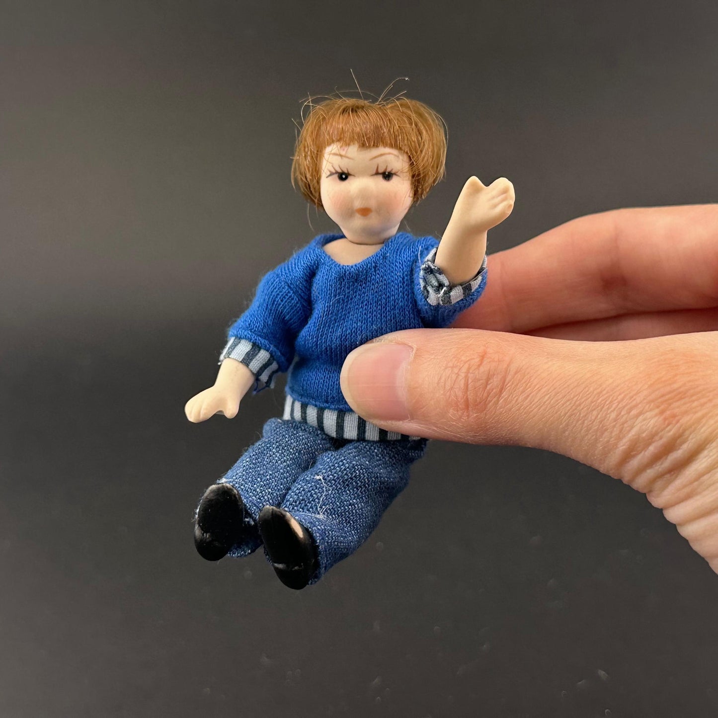 1:12 Scale Porcelain girl Doll – Dollhouse Miniature Child – Movable Head and Limbs – Blue Sweater & Jeans – 4” (10 cm)